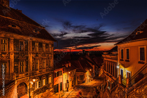 medieval street of lower Old Town Sibiu at night, Romania