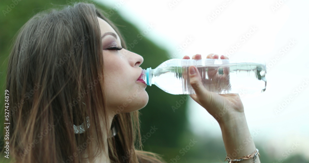 Closeup of attracrive young woman drinking water Closeup of attracrive young woman drinking water