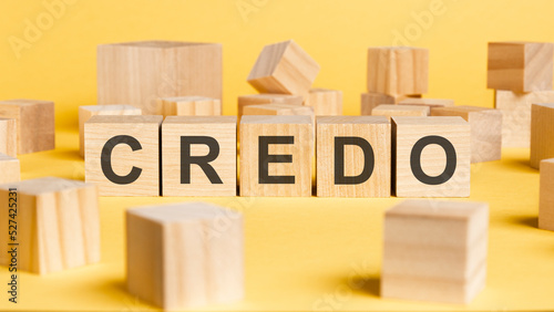 the word credo written on wooden cubes on yellow background photo