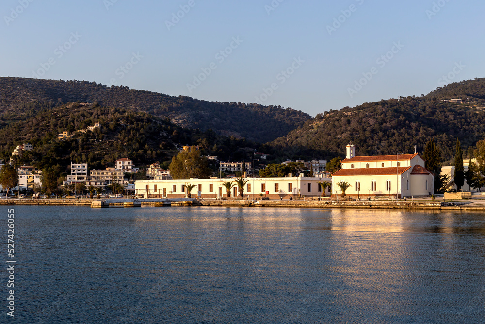 View of the embankment of the island of Poros (Greece) at sunset