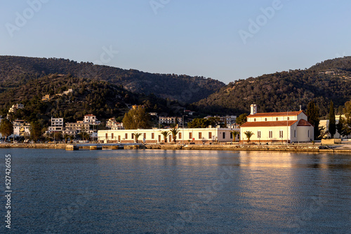 View of the embankment of the island of Poros (Greece) at sunset © TETYANA