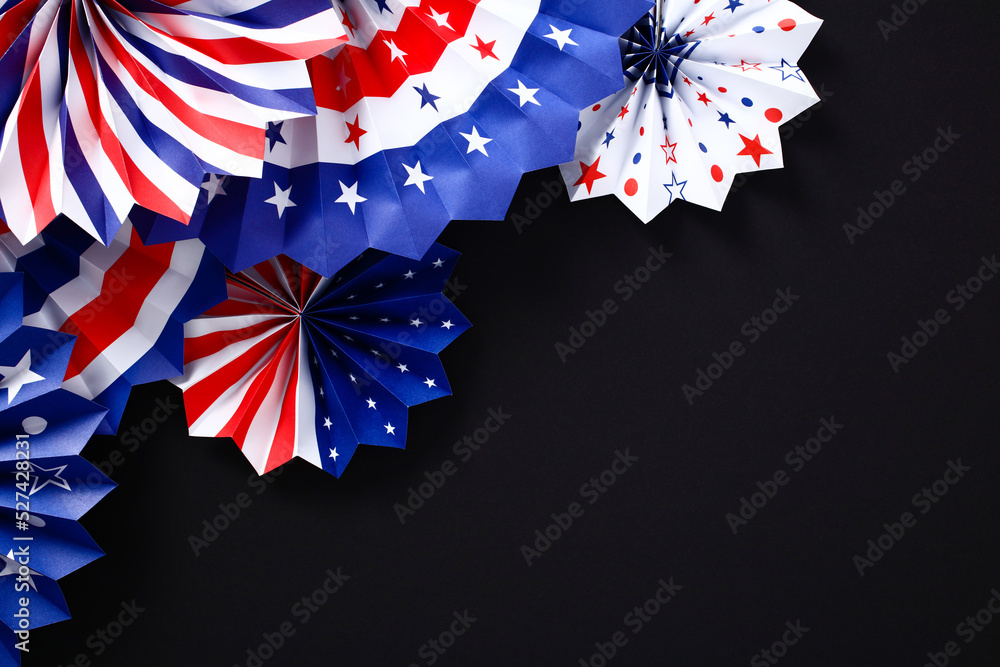 Fototapeta premium Red white and blue paper fans on black background. USA patriotic decorations for party. Happy American Independence Day, fourth of July, Labor Day, Presidents Day banner design.
