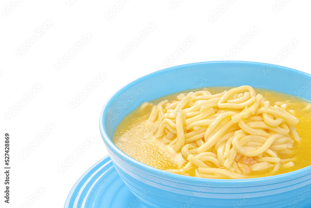 Chicken noodle soup in blue bowl with copy space Chicken noodle soup in blue bowl with copy space