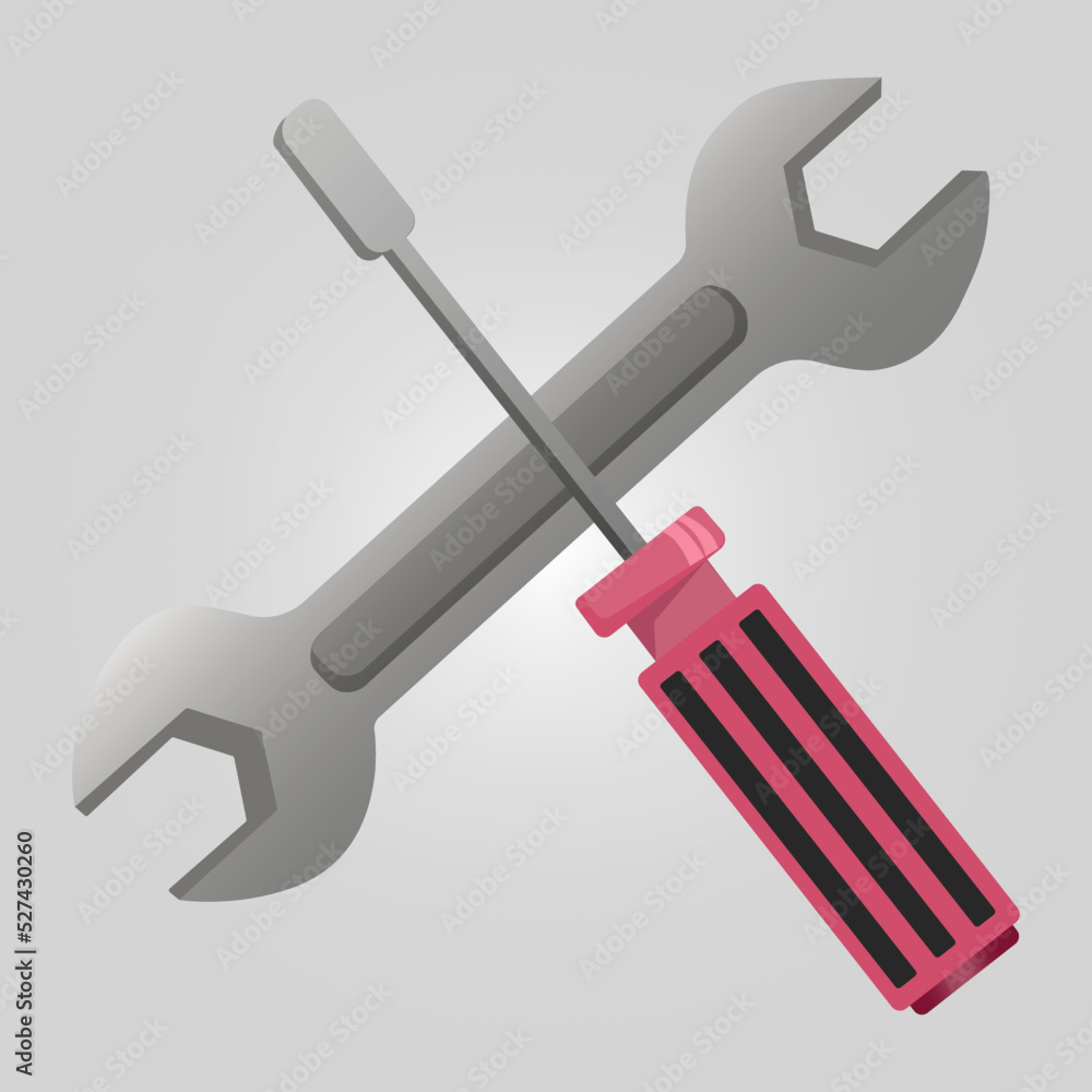 Wrench key and screwdriver tools crossed. Wrench key and screwdriver tools crossed.