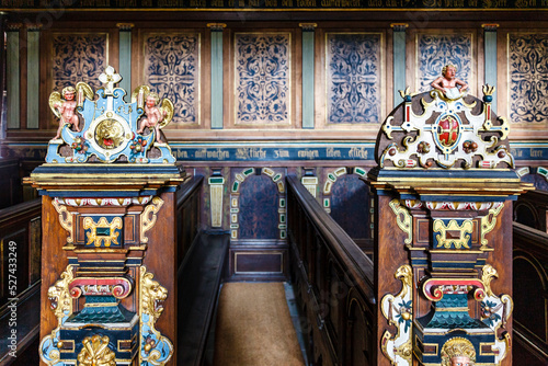 Pew with rich ornate colorful woodwork in the chapel of Kronborg Slot castle in Helsingor, Denmark, Europe