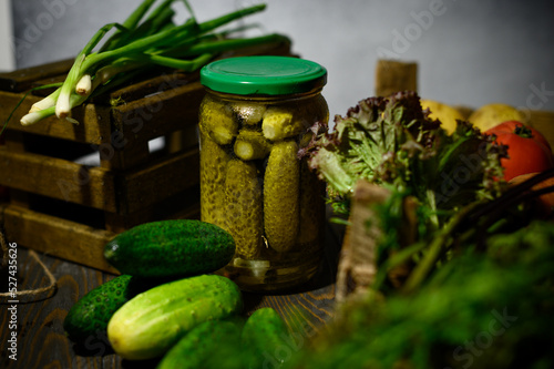 Glass jar with pickled cucumbers