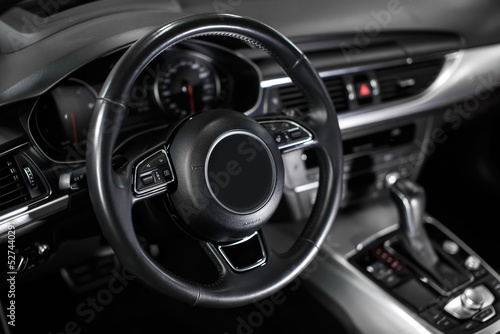 Steering wheel in the new modern car. © kucheruk