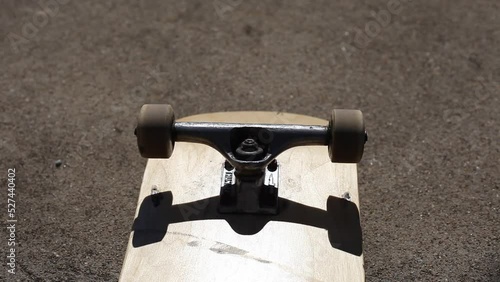 Skateboard Wheels Rolling Mid Afternoon Sunlight Outdoor Lighting photo