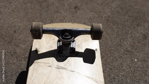 Skateboard Wheels Rolling Mid Afternoon Sunlight Outdoor Lighting photo