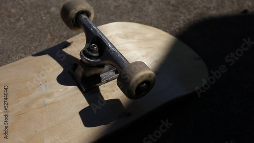 Skateboard Wheels Rolling Mid Afternoon Sunlight Outdoor Lighting photo