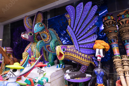 Alebrijes for sale in a traditional mexican shop, alebrije with eagle and fantasy animal forms, traditions of mexico, in Oaxaca, Puebla, Veracruz and south