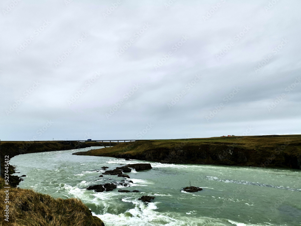 horizontal river water flow wild nature iceland grey clouds roadtrip