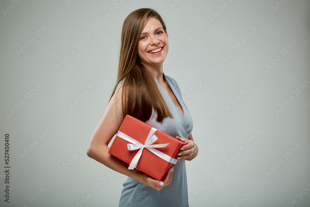 Happy woman holding red gift box with white ribbon. isolated studio female portrait. Happy woman holding red gift box with white ribbon. isolated studio female portrait.