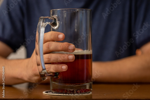 Close-up of Man s Hand Holding a Stein of Beer