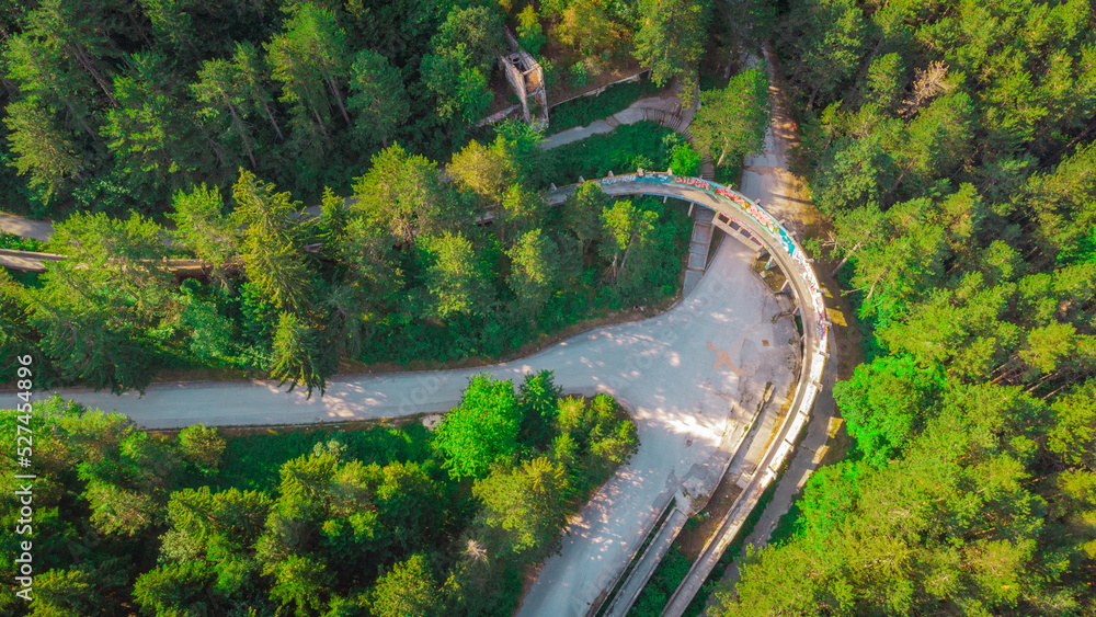 Aerial view of Abandoned or deserted remains of former bobsleigh track in Sarajevo, for the 1984 winter games.