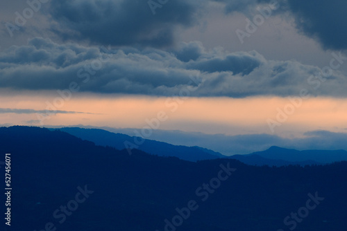 Blue and orange peaceful and serene cloudy sunset near the beautiful colonial city of Villa de Leyva in Colombia. photo