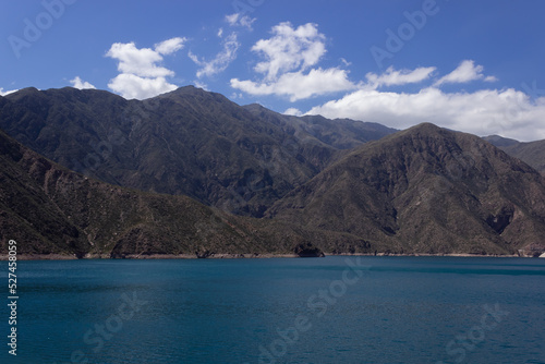 Beautiful scenery with a lake and mountains on a cloudy day.