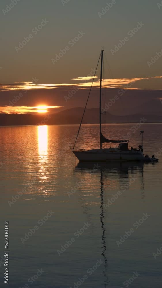 Pacific Northwest Sunrise Sailboat vertical video 4K UHD. A sailboat anchored at sunrise in the Pacific Northwest. Vertical video. 4K, UHD.
Pacific Northwest Sunrise Sailboat vertical video 4K UHD. A sailboat anchored at sunrise in the Pacific Northwest. Vertical video. 4K, UHD.