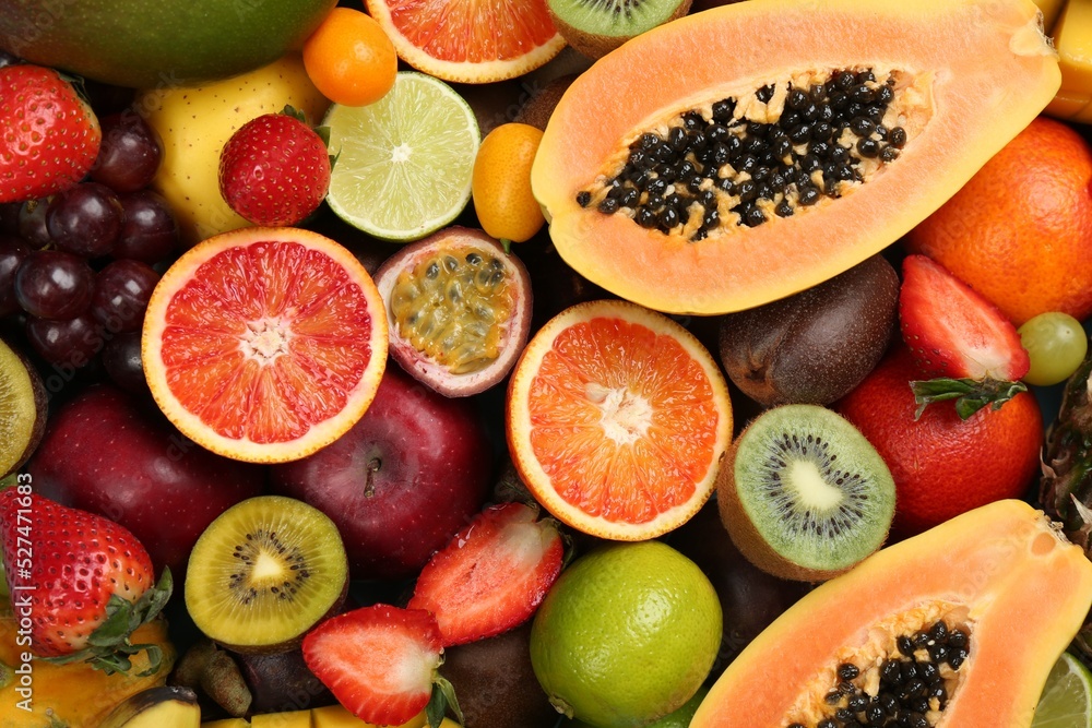 Many different delicious exotic fruits as background, top view Many different delicious exotic fruits as background, top view