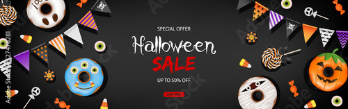 Halloween sale banner with colorful pennants and sweets