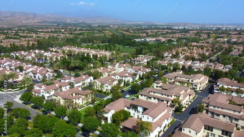Homes in Irvine, California. 4K aerial view of Woodbury Village, a large scale master-planned neighborhood in Orange County with award winning schools, parks, and resort style amenities. Homes in Irvine, California. 4K aerial view of Woodbury Village, a large scale master-planned neighborhood in Orange County with award winning schools, parks, and resort style amenities.