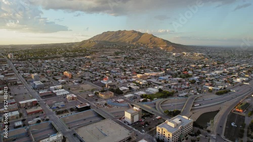 El Paso Texas USA. Aerial Drone Shot Of El Paso Central Area With Franklin Mountains In The Background During Sunset With Cars Driving On I-10 Freeway. photo