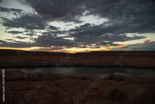 Dark clouds at sunset over Colorado River, Arizona