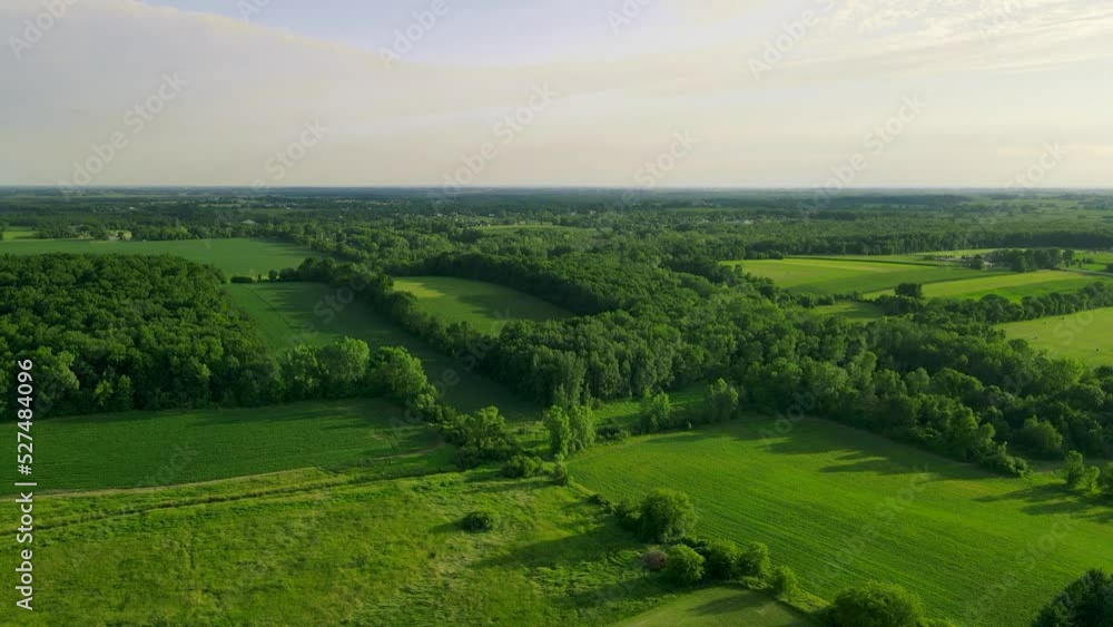 The drone takes a flight through a rural area of wisconsin with meadows,farm fields, and forests. The drone takes a flight through a rural area of wisconsin with meadows,farm fields, and forests.