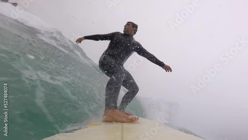 Young man surfing ocean waves gopro angular view shot. winter season. Strong cutback and beautiful snap on the end. Adraga, Portugal photo