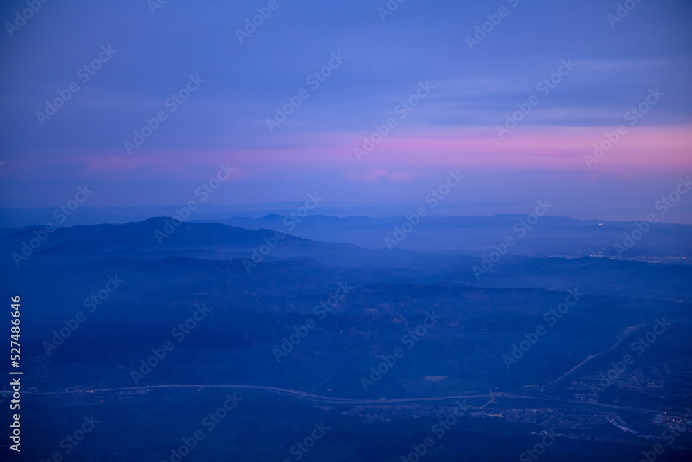 blue and pink sunset sky over mountains