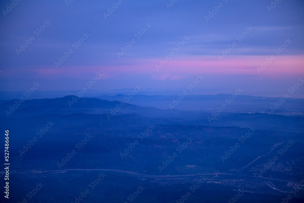 blue and pink sunset sky over mountains blue and pink sunset sky over mountains