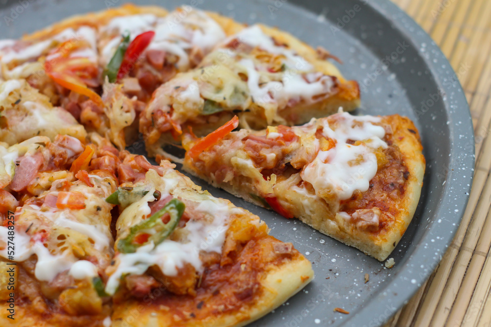 Delicious home made pizza with extra cheese. Delicious home made pizza with extra cheese.