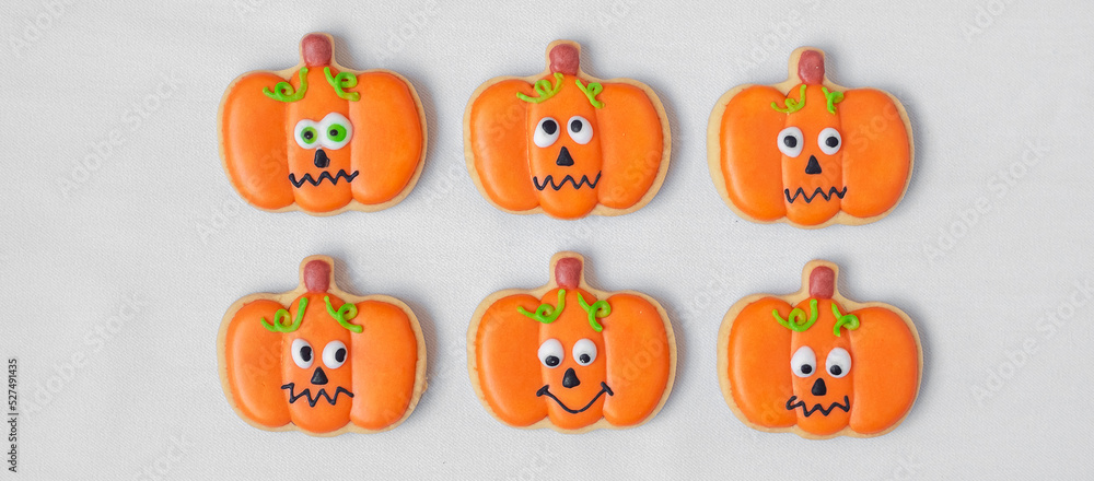 Happy Halloween day with funny Cookies, different Pumpkin biscuits on table background. Trick or Threat, Hello October, fall autumn, Traditional, party and holiday concept Happy Halloween day with funny Cookies, different Pumpkin biscuits on table background. Trick or Threat, Hello October, fall autumn, Traditional, party and holiday concept