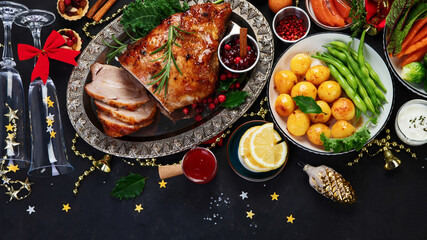 Traditional Christmas dinner on dark background.