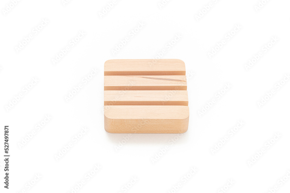 Wooden card holder isolated on white background. Wood surface. Minimalist object. Stationery. Simplicity. Workspace. Equipment. Wooden card holder isolated on white background. Wood surface. Minimalist object. Stationery. Simplicity. Workspace. Equipment.