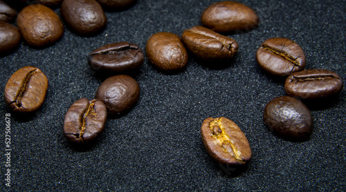 The way coffee beans lay on a black background  elegant and delicious coffee beans and the aroma of morning coffee.