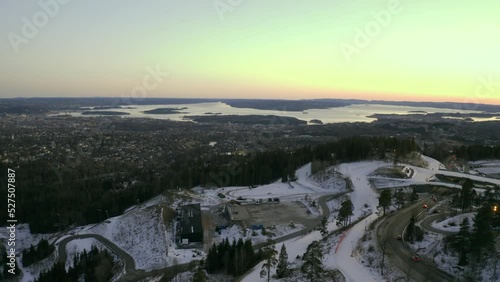 Oslo city pull back 2 with Norwegian sea, Vinterpark Winterpark Tryvann Drone Push in Past Ski Jump at Sunset Holmenkollen ski jump photo