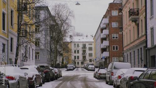 Snowy city street in Oslo, Majorstuen neighborhood with cars, snow, winter photo