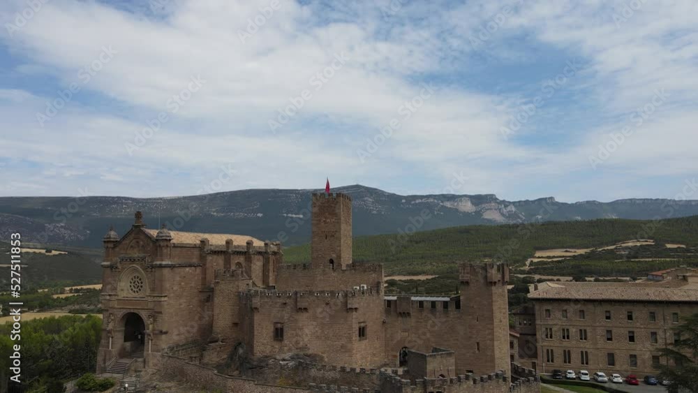 Stunning 10th century Javier Castle in Spain with tiny tourists. Aerial take off. Stunning 10th century Javier Castle in Spain with tiny tourists. Aerial take off.