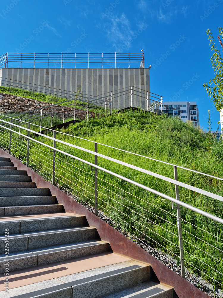 Building with lawn and uphill stairs. Building with lawn and uphill stairs.