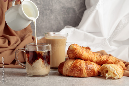 Croissants and coffee with cream.