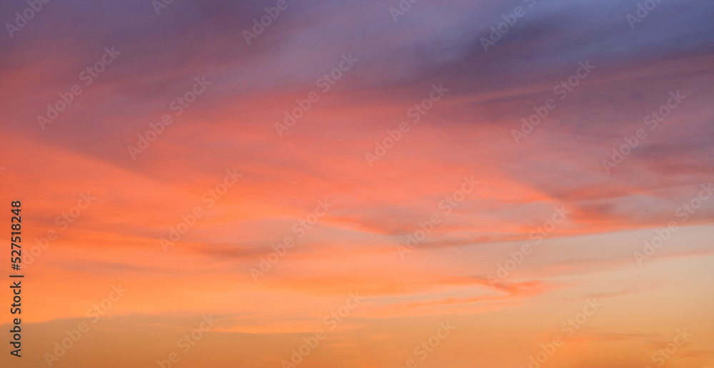 Evening sky scene with golden light from the setting sun