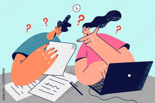 Confused couple manage paperwork at home 