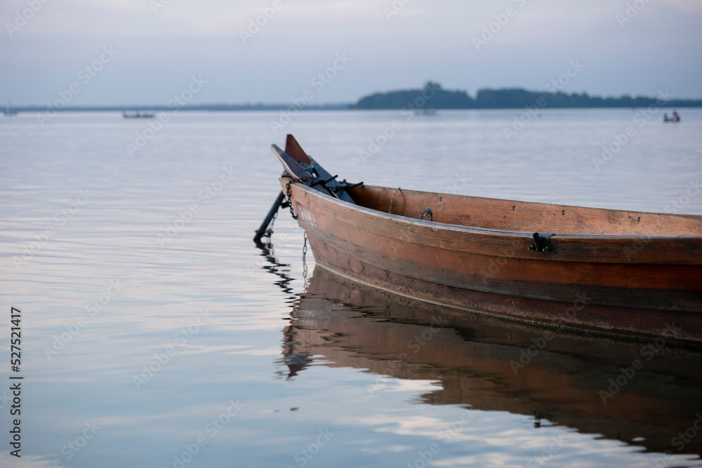 Boat on the shore of the lake. Beach by the lake