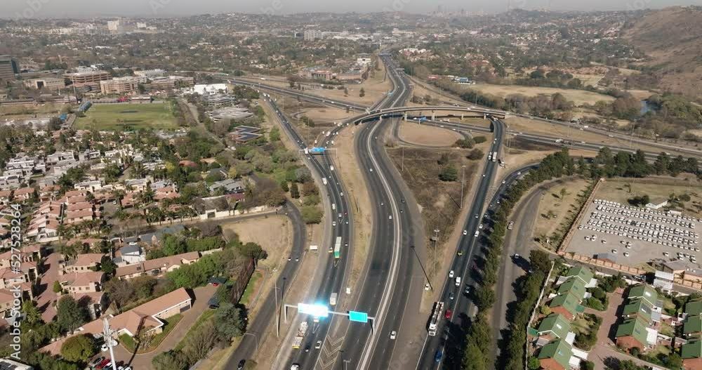 Aerial view of Johannesburg Gillooly's interchange. Johannesburg skyline in the background surrounded by smog and pollution Aerial view of Johannesburg Gillooly's interchange. Johannesburg skyline in the background surrounded by smog and pollution