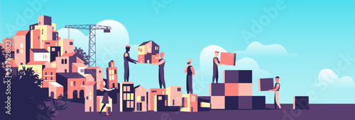 Persone che costruiscono la città con strutture modulari