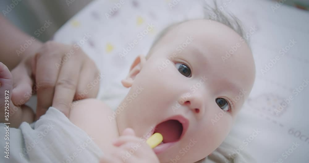 Portrait Closeup Little cute adorable Asian baby girl brushing her teeth with a toothbrush in bathroom in the morning Portrait Closeup Little cute adorable Asian baby girl brushing her teeth with a toothbrush in bathroom in the morning