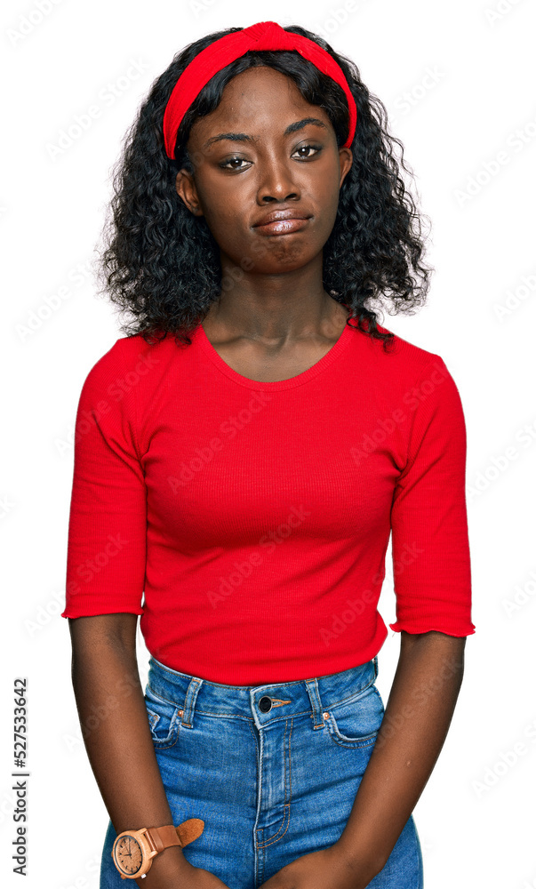 Beautiful african young woman wearing casual clothes depressed and worry for distress, crying angry and afraid. sad expression. Beautiful african young woman wearing casual clothes depressed and worry for distress, crying angry and afraid. sad expression.