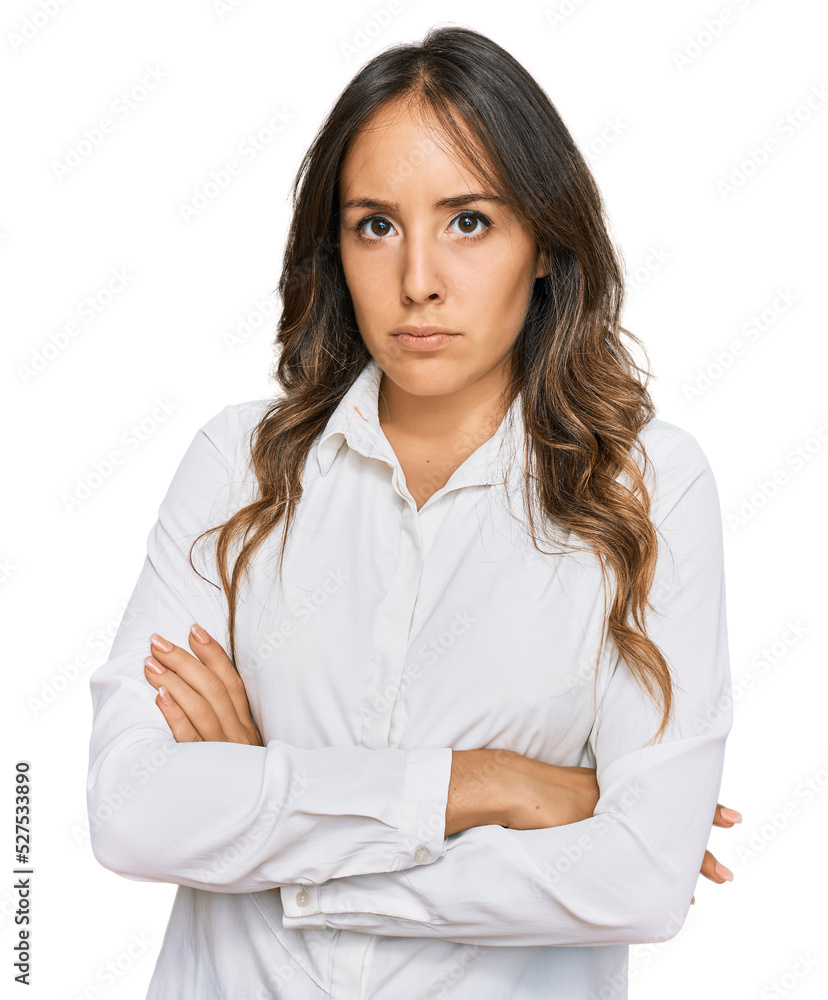 Young brunette woman wearing casual clothes skeptic and nervous, disapproving expression on face with crossed arms. negative person. Young brunette woman wearing casual clothes skeptic and nervous, disapproving expression on face with crossed arms. negative person.