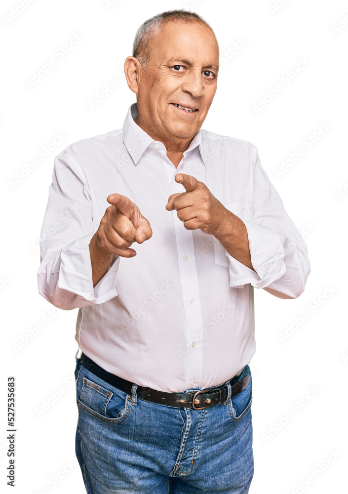 Handsome senior man wearing elegant white shirt pointing fingers to camera with happy and funny face. good energy and vibes. Handsome senior man wearing elegant white shirt pointing fingers to camera with happy and funny face. good energy and vibes.